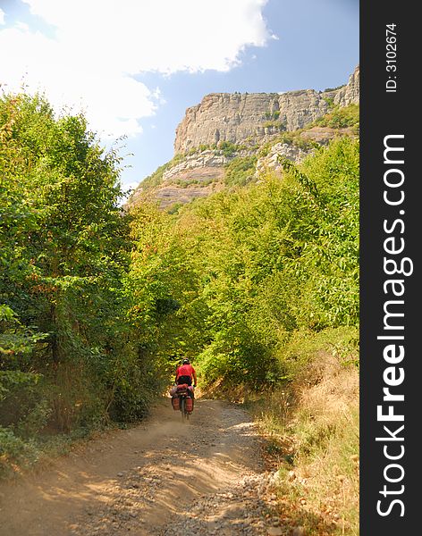 Biker on the mountain road. (Dimerdzhi mountain in Crimea, Ukraine)