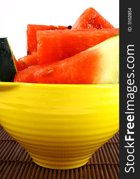 Background of brightly lit red watermelon slices.