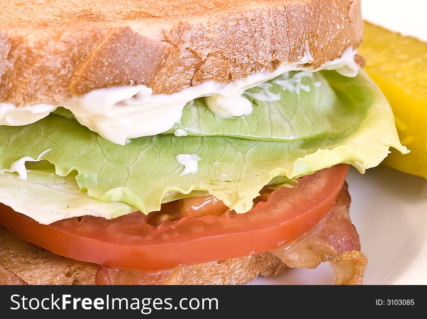 A fresh BLT sandwich with lots of bacon, fresh tomatoes, lettuce and mayo