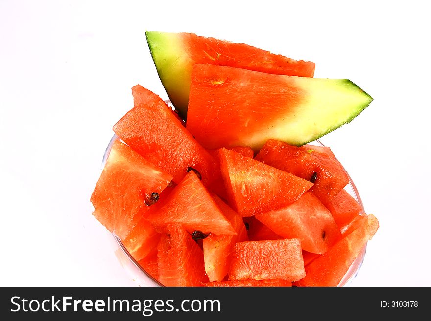 Background of brightly lit red watermelon slices. Background of brightly lit red watermelon slices.