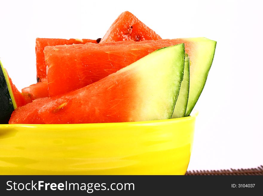 Background of brightly lit red watermelon slices.
