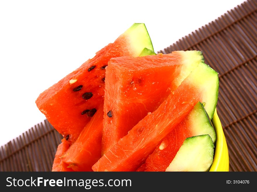 Background of brightly lit red watermelon slices.