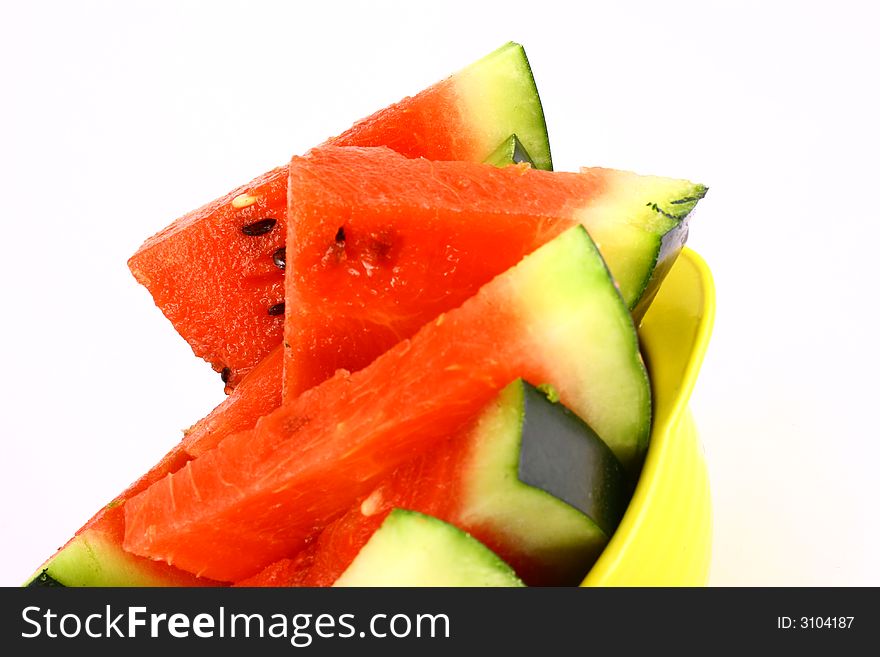 Background of brightly lit red watermelon slices.