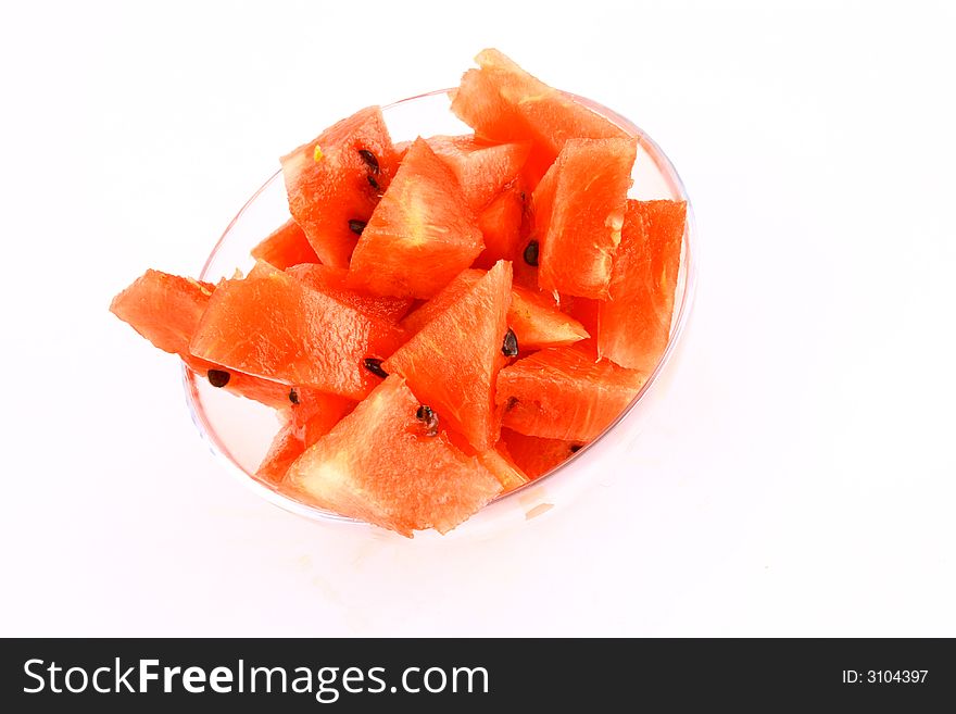 Background of brightly lit red watermelon slices.