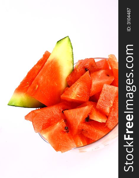 Background of brightly lit red watermelon slices. Background of brightly lit red watermelon slices.