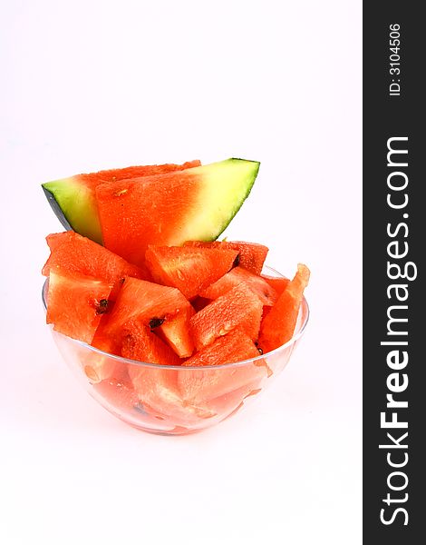 Background of brightly lit red watermelon slices. Background of brightly lit red watermelon slices.