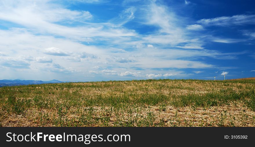 Dramatic cloudy sky over a fresh field. Dramatic cloudy sky over a fresh field