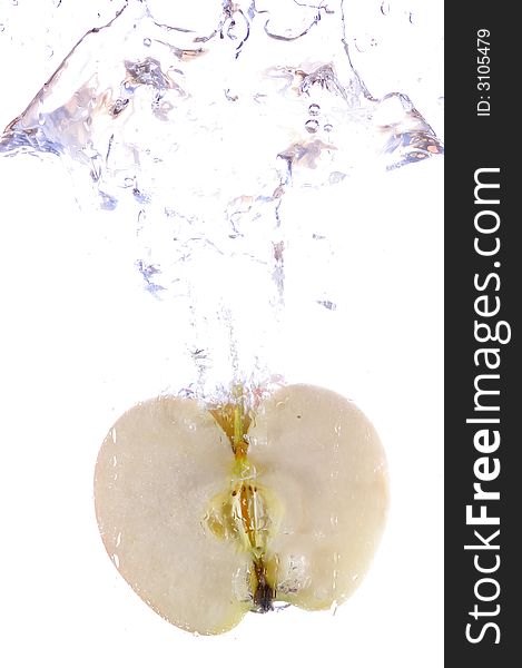 Photographs of an half of apple splashing in water