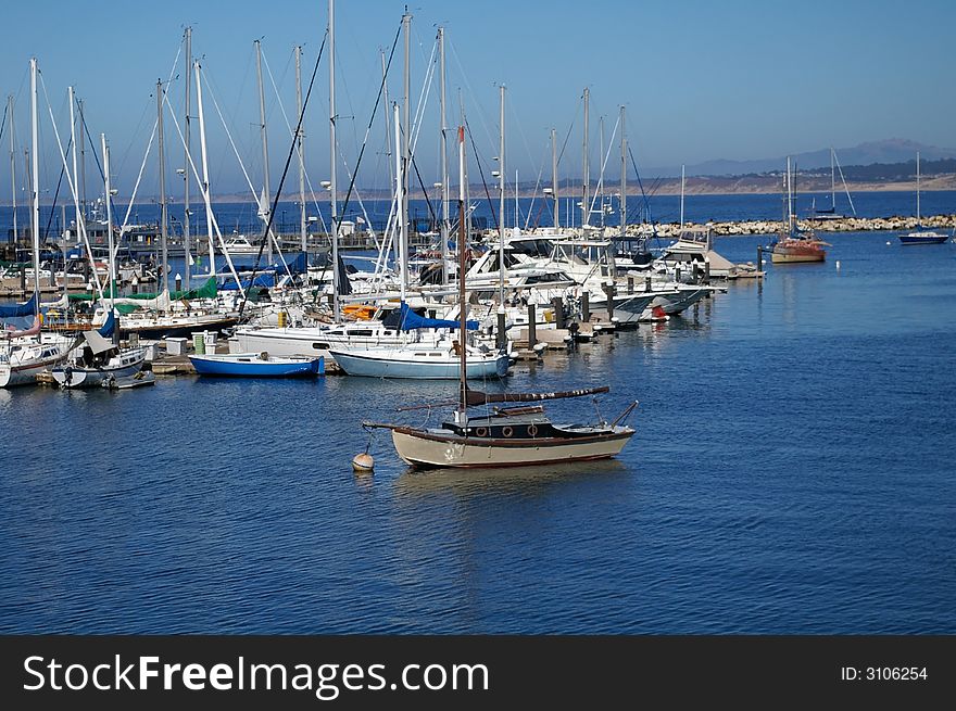 Picture of a sailboat moored in a harbor. Picture of a sailboat moored in a harbor.