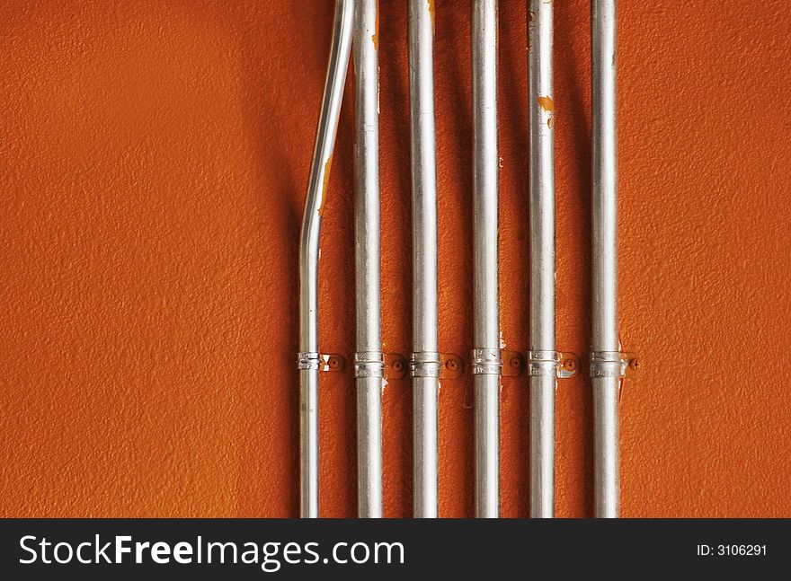 Pipes on an Orange Wall
