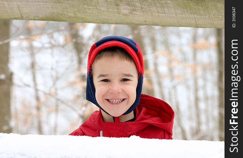 Boy in Winter Wearing Red with a big Smile