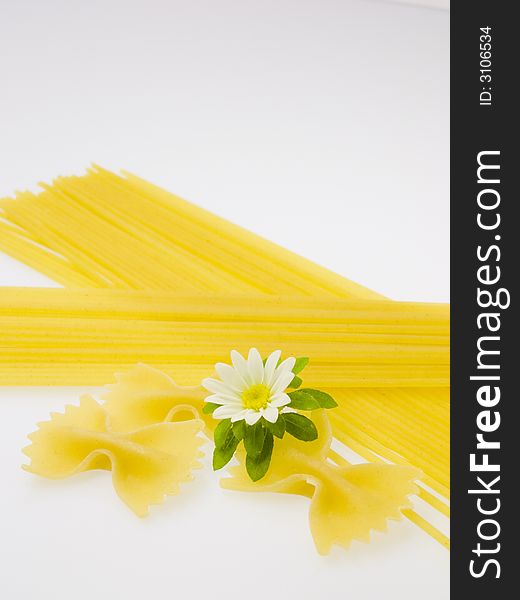 Noodles prepared for boiling on a white background. Noodles prepared for boiling on a white background