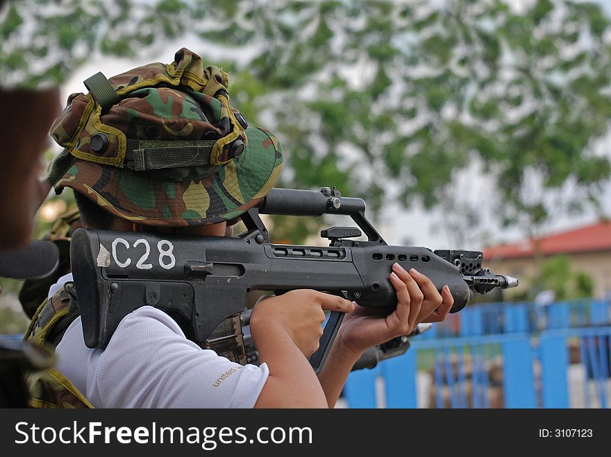 Man testing the machine gun in the army camps