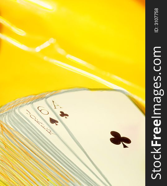 Playing cards on a yellow background