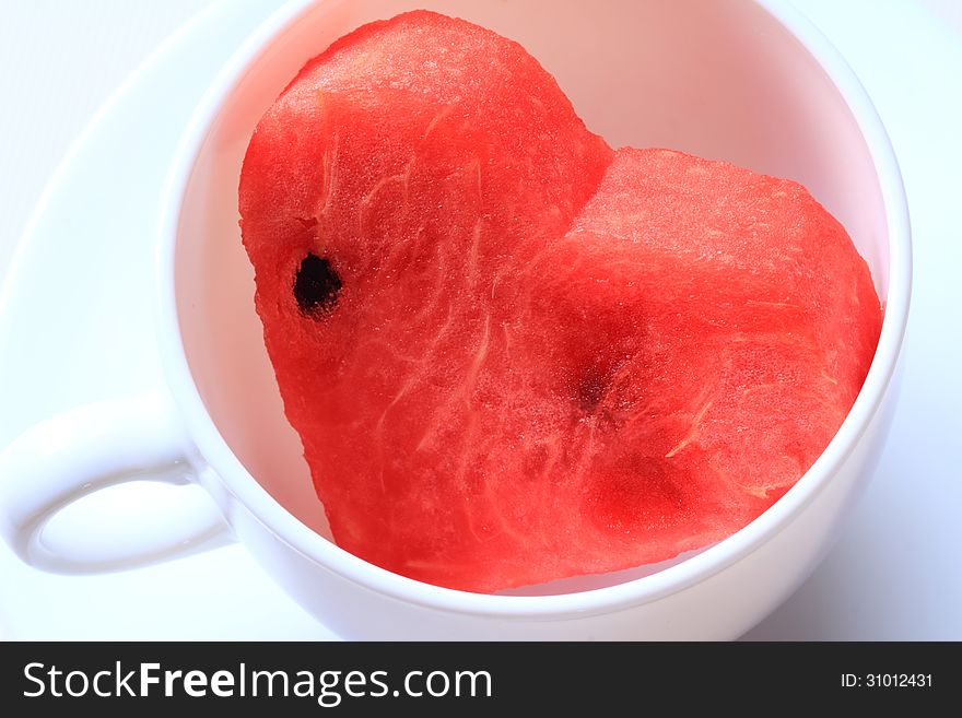 Water melon cut into heart shape. Water melon cut into heart shape.