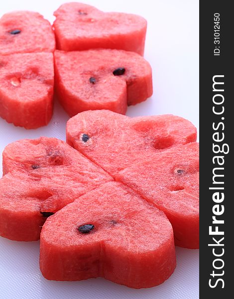 Water melon cut into heart shape pieces. Water melon cut into heart shape pieces.