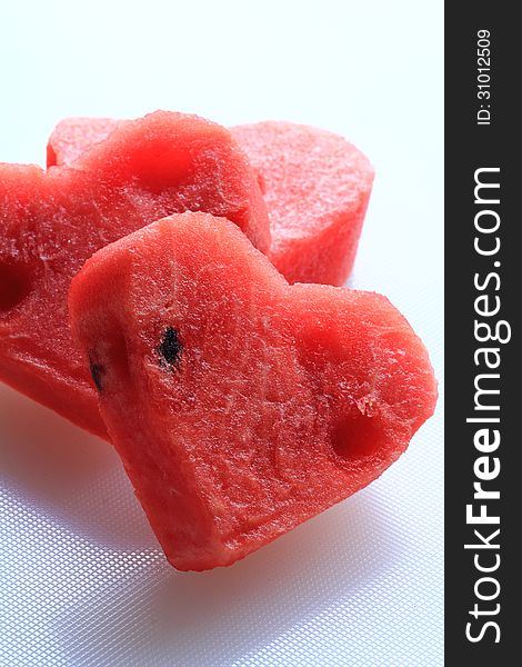 Water melon cut into heart shape. Water melon cut into heart shape.
