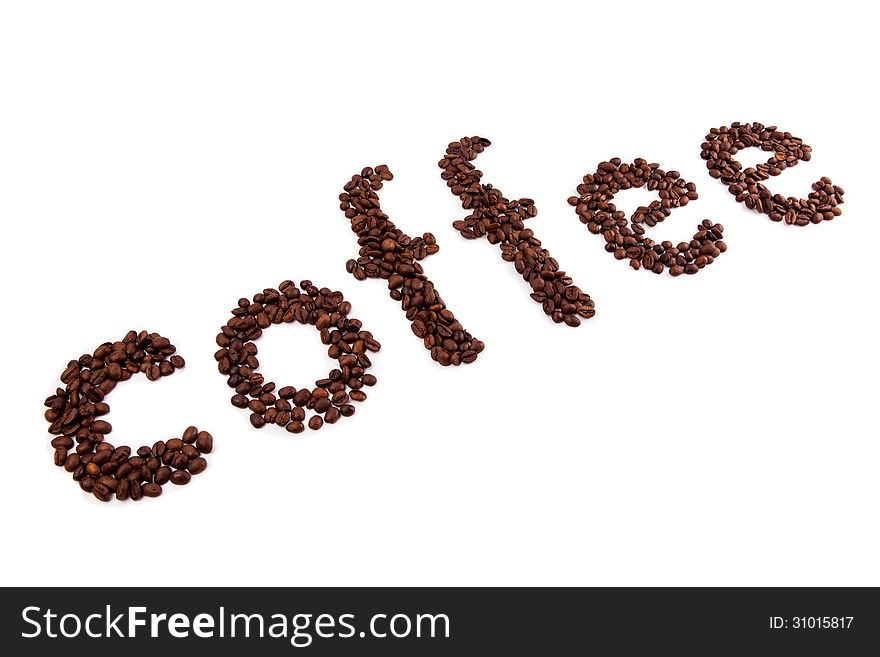 Inscription by roasted coffee beans on a white background