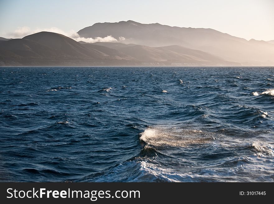 Ocean and misty mountains of Santa Cruz Island, part of the Cahnnel Islands off Southern California. Ocean and misty mountains of Santa Cruz Island, part of the Cahnnel Islands off Southern California