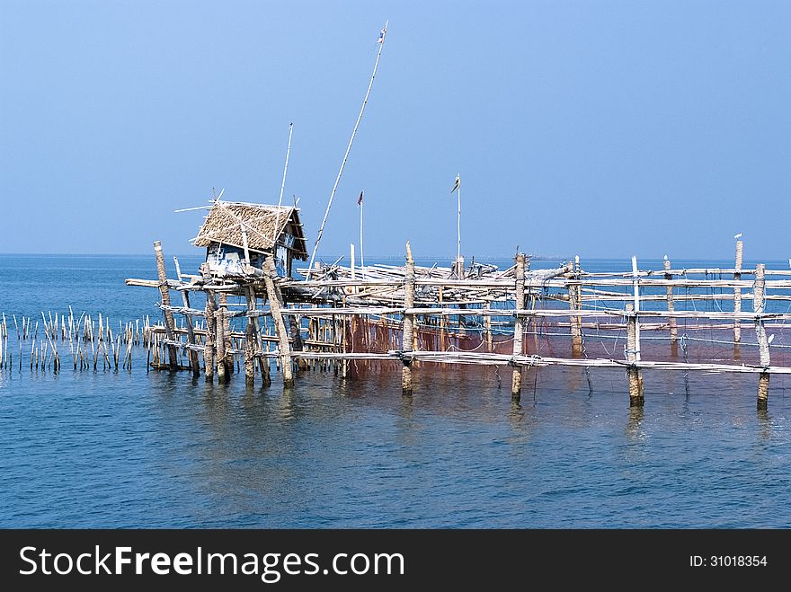 Trap net/stake trap at the mouth of the Mae Klong river to the Gulf of Thailand in Samutsongkram. Trap net/stake trap at the mouth of the Mae Klong river to the Gulf of Thailand in Samutsongkram