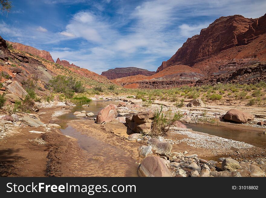 The Paria Canyon is located in Arizona and Utah, and is a 38 mile long canyon trip by means of backpacking. One makes thousands of stream crossings in this spectacular area, until the canyon widens out and ends in Lee's Ferry, Arizona.