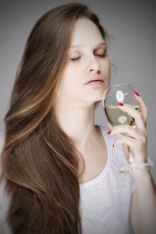 Beautiful Dreamy Woman Smelling A Glass Of White Wine Royalty Free Stock Image