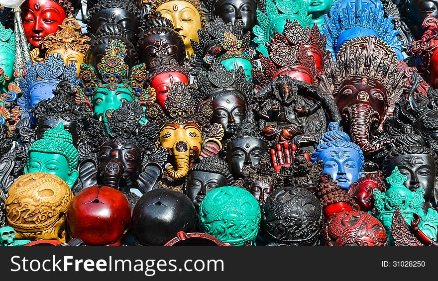 Detail of various wooden carved masks and decorations, market in Kathmandu