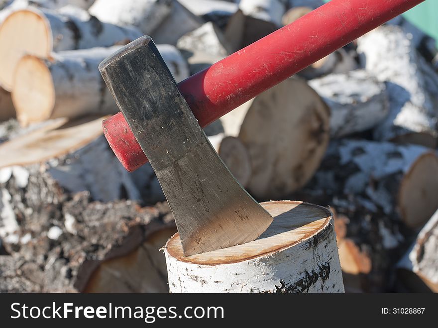 Axe in stump for chopping firewood