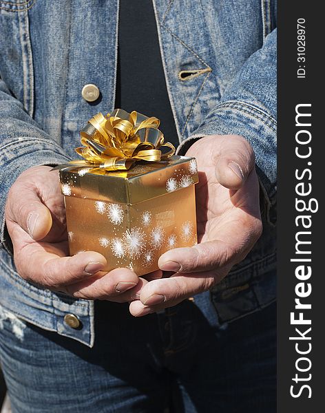 Man with orange gift box with bow