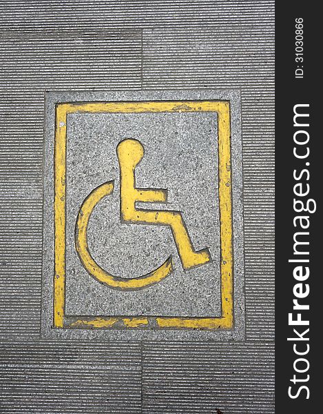 Wheelchair logo on the floor.