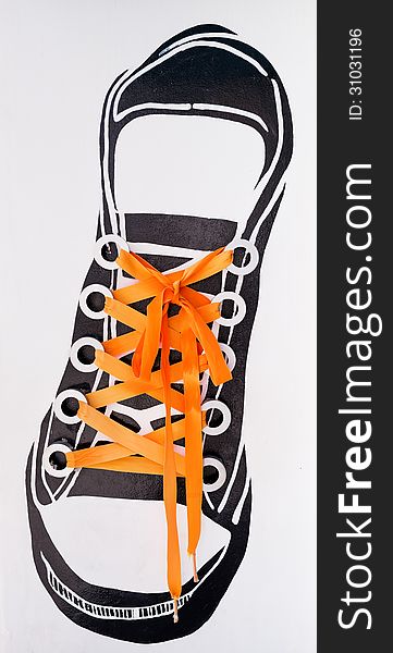 Orange string tied shoes sneakers wall decorate