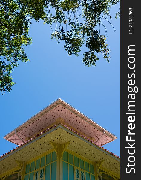 House wooden lath roof with clear blue sky tree frame composition