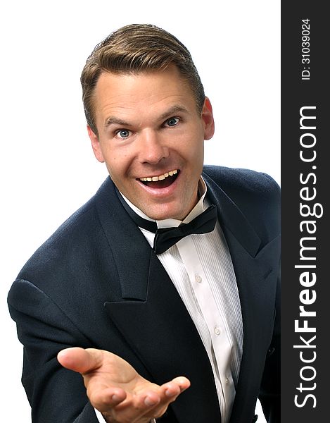 Portrait of handsome male Caucasian host wearing black tuxedo making welcoming hand gesture on white background. Portrait of handsome male Caucasian host wearing black tuxedo making welcoming hand gesture on white background