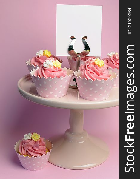 Beautiful Pink Decorated Cupcakes On Pink Cake Stand - Vertical With Blank Sign.