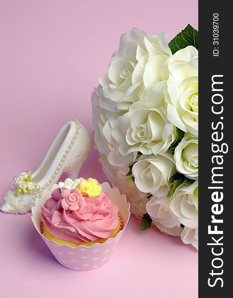 Wedding white roses bouquet with pink cupcake and good luck shoe.- vertical. Wedding white roses bouquet with pink cupcake and good luck shoe.- vertical.