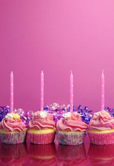 Pink Birthday Cupcakes With Polka Dot Candles - Vertical With Copy Space. Stock Image Pink Birthday Cupcakes With Polka Dot Candles - Vertical With Copy Space. Stock Image