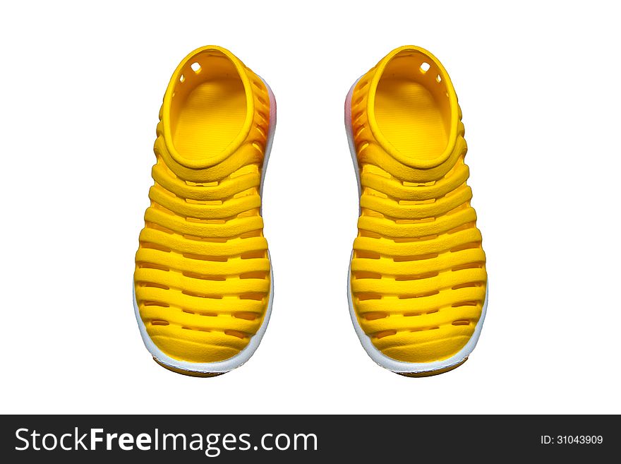 Bright yellow clogs isolated on white background. Bright yellow clogs isolated on white background.