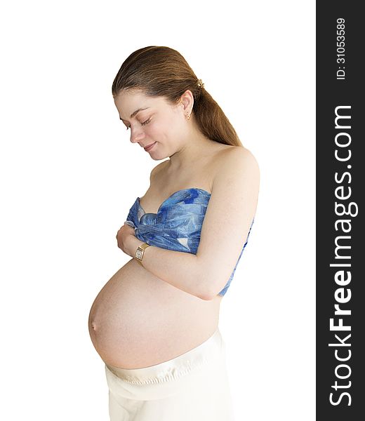 The happy young pregnant woman is isolated on a white background. The happy young pregnant woman is isolated on a white background.