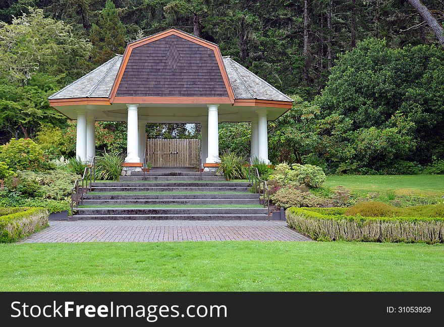 Large white gazebo in green park