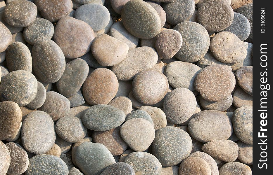 Texture of gray and beige pebbles. Texture of gray and beige pebbles
