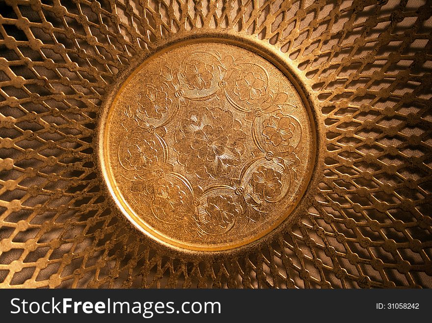Golden oriental dishware symbol of wealth