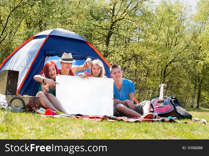 Youth On A Camping With An Empty Sign Board