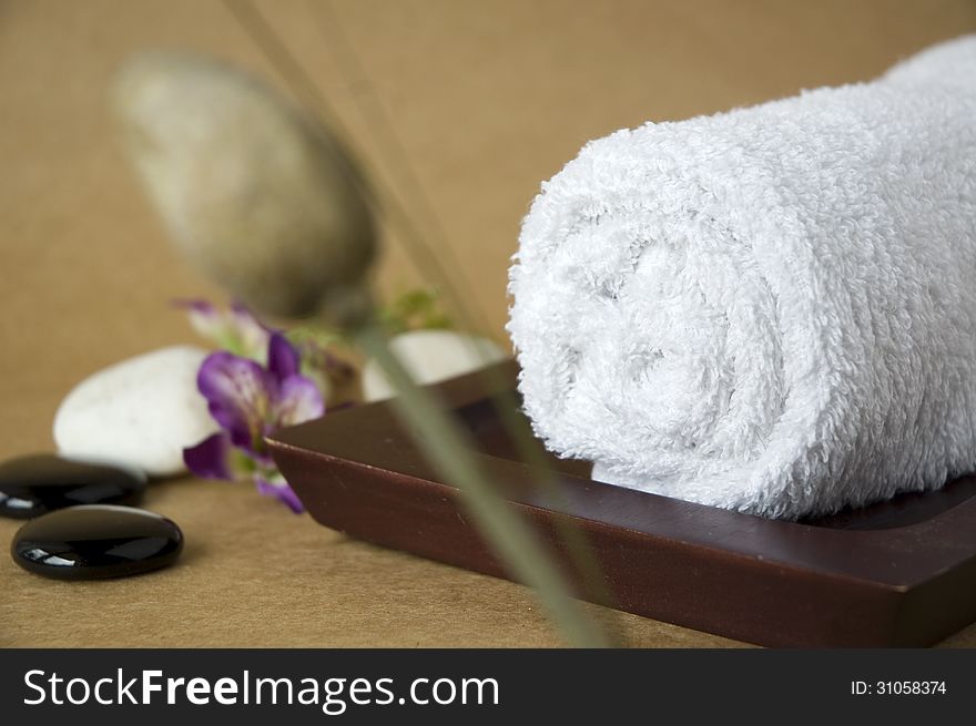 White towel on wooden tray for spa. White towel on wooden tray for spa
