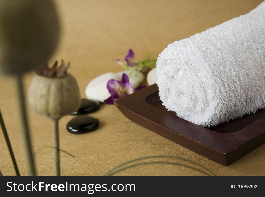 White towel on tray with flowers. White towel on tray with flowers