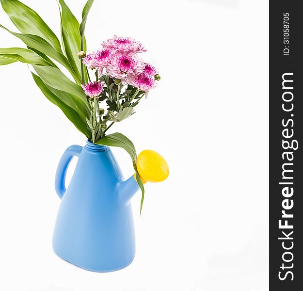 Flowers in blue watering can. Flowers in blue watering can.