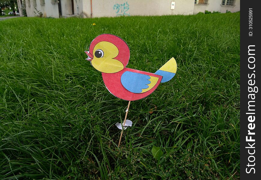 Cardboard bird in the park