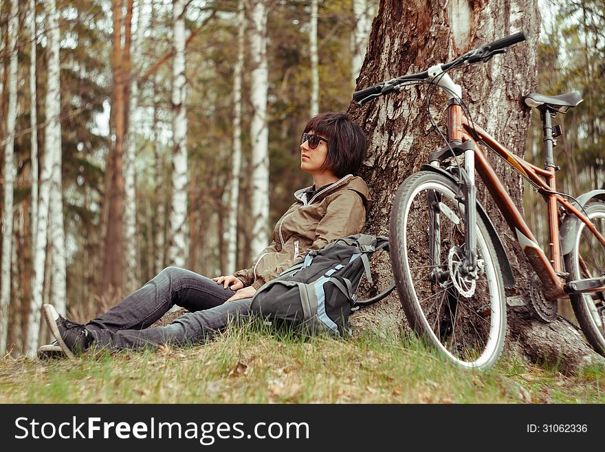 Young Woman Sitting On Nature