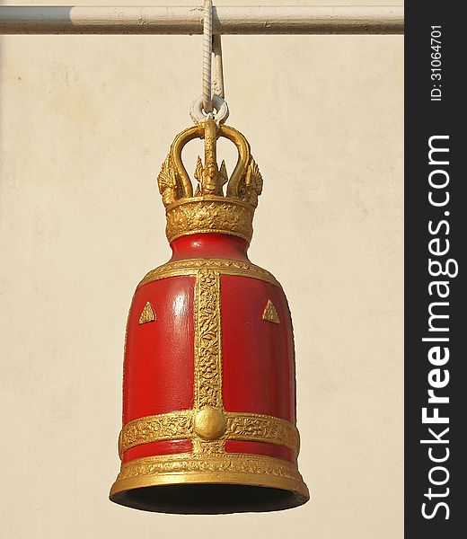 Decorative of red ancient bell with gold in sunny day