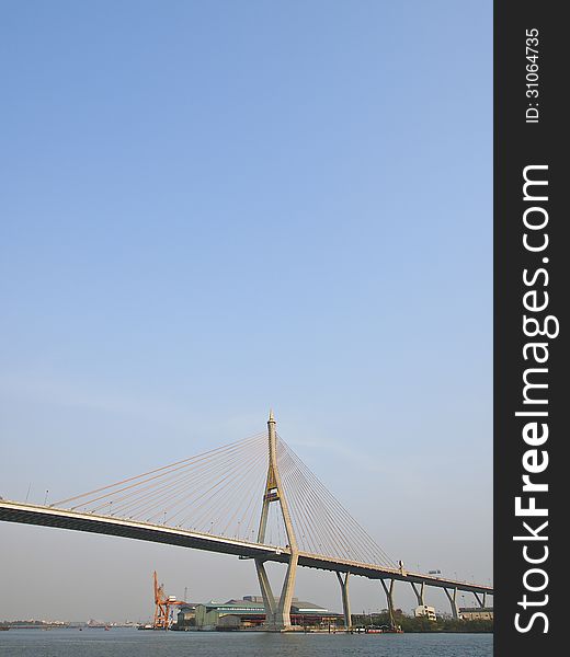 View of Bhumibol bridge across Chao Phraya river and sky at Phra Pradaeng, Samut Prakan province, Thailand