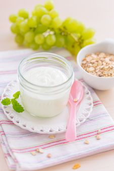 Healthy Breakfast With Yogurt And Muesli And Grapes Stock Photo